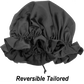 Qfitt black reversible satin bonnet with ruffled edge detail