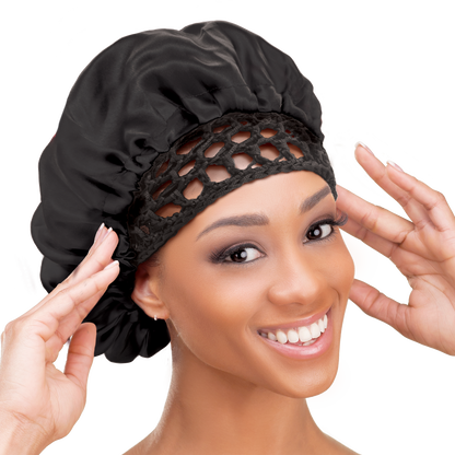 Woman wearing the Qfitt Doobie Cap With Silky Bonnet to help protect her wrapped hairstyle overnight.