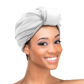 Woman wearing the Qfitt Doobie Cap With Silky Scarf, a hair wrap cap with an attached scarf.