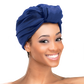 Woman wearing the Qfitt Doobie Cap With Silky Scarf, a hair wrap cap with an attached scarf.